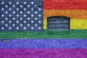 Image of a wall with the gay colored flag on it